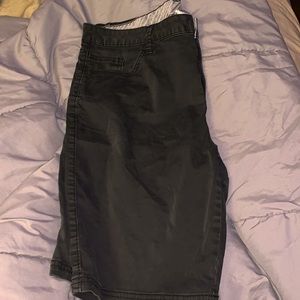 Black Bermuda golf shorts.